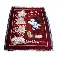 Full view of woven Walt Disney World Mickey Mouse fringed blanket