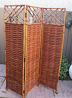 Full view of folded bamboo and pencil reed three-panel screen
