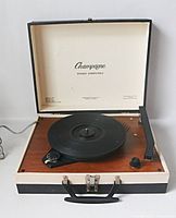 Open Champagne portable turntable showing full unit and branding