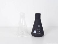 clear and black glass flask vases side by side