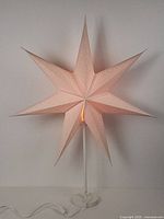 Lit star paper table lamp front view