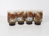All four Libbey Camellia Tawny tumbler glasses front view
