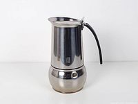 Full front view of stainless steel Guido Bergna espresso maker showing logo and form