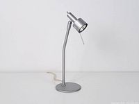 Full view of Ikea Vira desk lamp standing upright