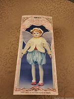 Front of original Enesco box showing Pear Blossom Fairy porcelain doll