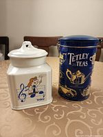 Front view of both Tetley containers showing graphics and form