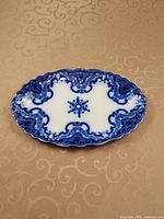 Top view of oval flow blue platter showing pattern and shape