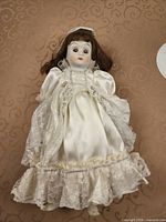 Full view of bride porcelain doll in gown