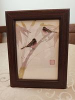 Framed Chinese bird painting front view showing artwork, frame and seal