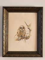 Front view of framed owl print showing image, mat, and ornate frame