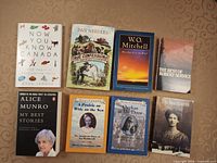 All eight books laid out, front covers visible