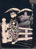 Front view of framed mother of pearl geisha portrait