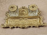 Brass desk stand with two glass inkwells, lids on