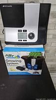 Bionaire humidifier beside boxed Jiffy Hydro Growing System