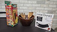 All three items boxed: Pasta Express cooker, wooden salad bowl with servers, Farberware scale in box