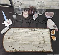 Entire lot overview showing mirror, glassware, hooks, figurines