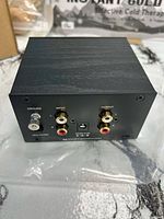 Rear panel showing ground terminal, RCA input/output jacks, 20 Hz filter switch