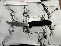 Full view of knife showing blade shape and handle