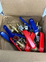 Box containing brass PEX ball valves with red and blue levers