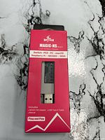 Front of box showing Mayflash MAGIC-NS adapter through window