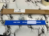 Overall view of Pro-Zero offset extension wrench, hardware bag, and cardboard box