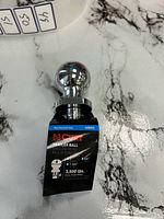 Curt model 40003 trailer hitch ball front view with packaging visible