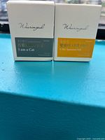 Front view of both sealed Wearingeul ink boxes