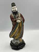 Front view of cloisonné statue on base