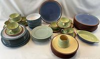 Full view of stoneware set showing plates, cups, saucers, bowls and serving pieces
