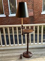 Full view of floor lamp with shade, table, and base