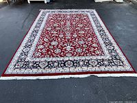 Full view of the Persian Sultan Abad carpet laid flat showing complete pattern and fringes