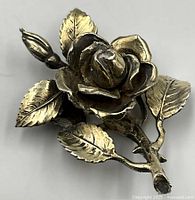 Front view of sterling silver rose brooch