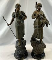 Both sculptures full view on bases