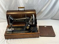 Machine in base with cover and bed panel