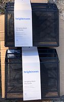 Two Brightroom black metal mesh hanging file sorters with labels