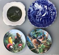 Group shot of all four plates showing designs and colours
