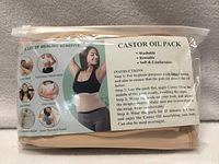 Front of packaged castor oil waist wrap showing product label and images