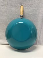 Full view of blue exterior base and wooden handle