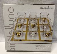 Front view of boxed tic-tac-toe shot glass set