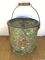 Full view of galvanized minnow bucket showing exterior and handle