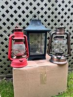 Group of three lanterns showing sizes, colors, styles