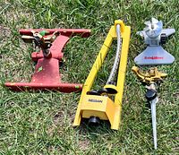 All four sprinklers laid out on grass