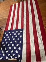 Flag laid out showing full field of stars and stripes