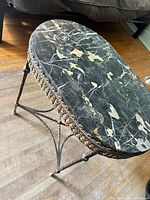 Full view of table showing marble top and metal base