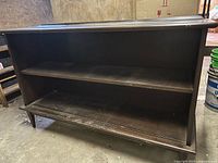 Front view showing open shelves and overall structure