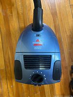 Top view of Bissell Zing canister body showing controls and hose port