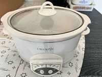 Front and top view showing full cooker and glass lid