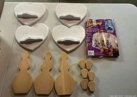 group shot of all wooden pieces and magazine