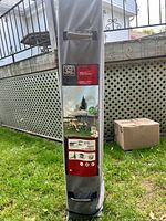 Full view of gazebo in gray carrying case showing brand and graphics