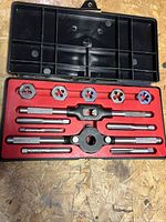 Open Craftsman tap and die set showing dies, taps, wrenches in case